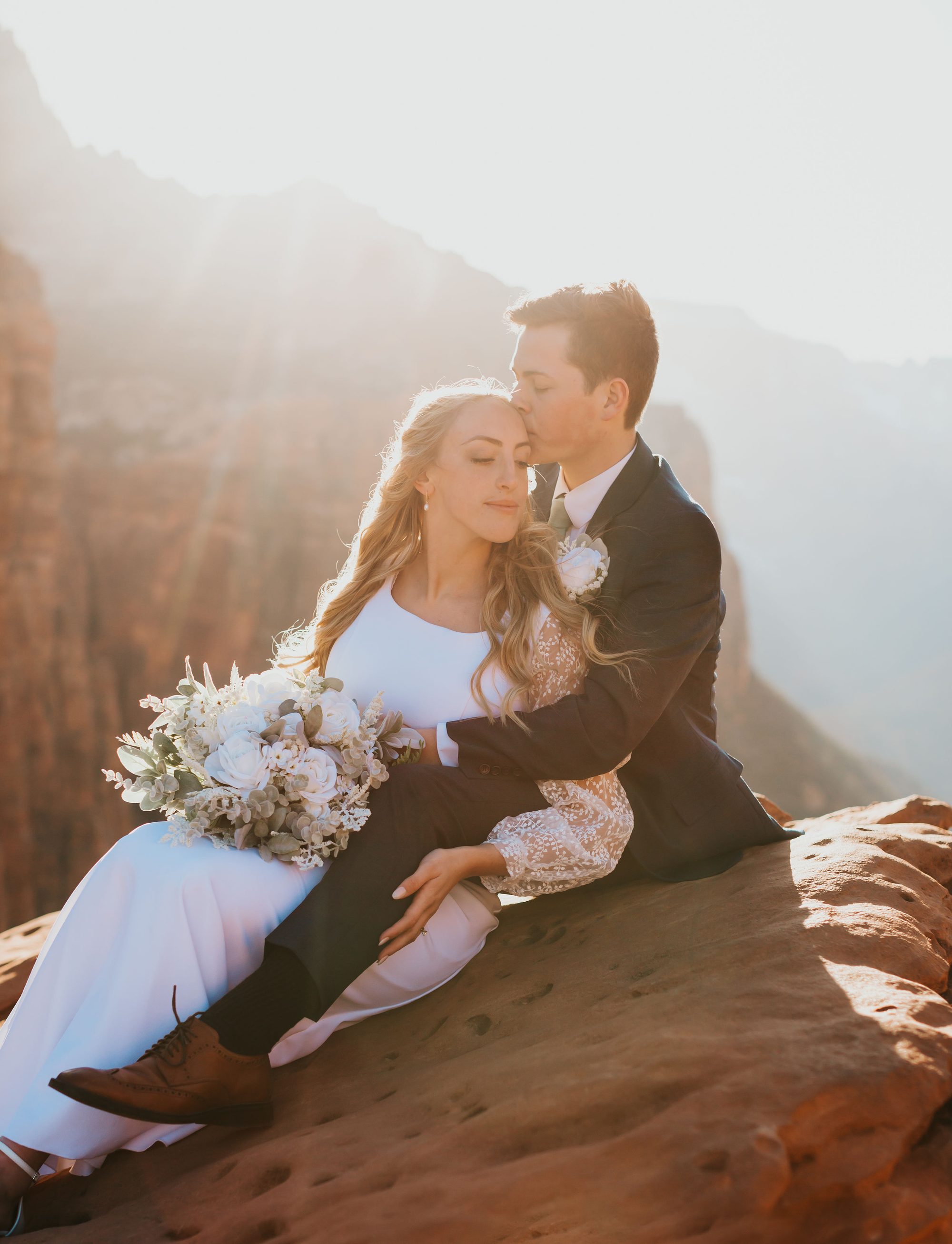 Couple at golden hour canyon overlook