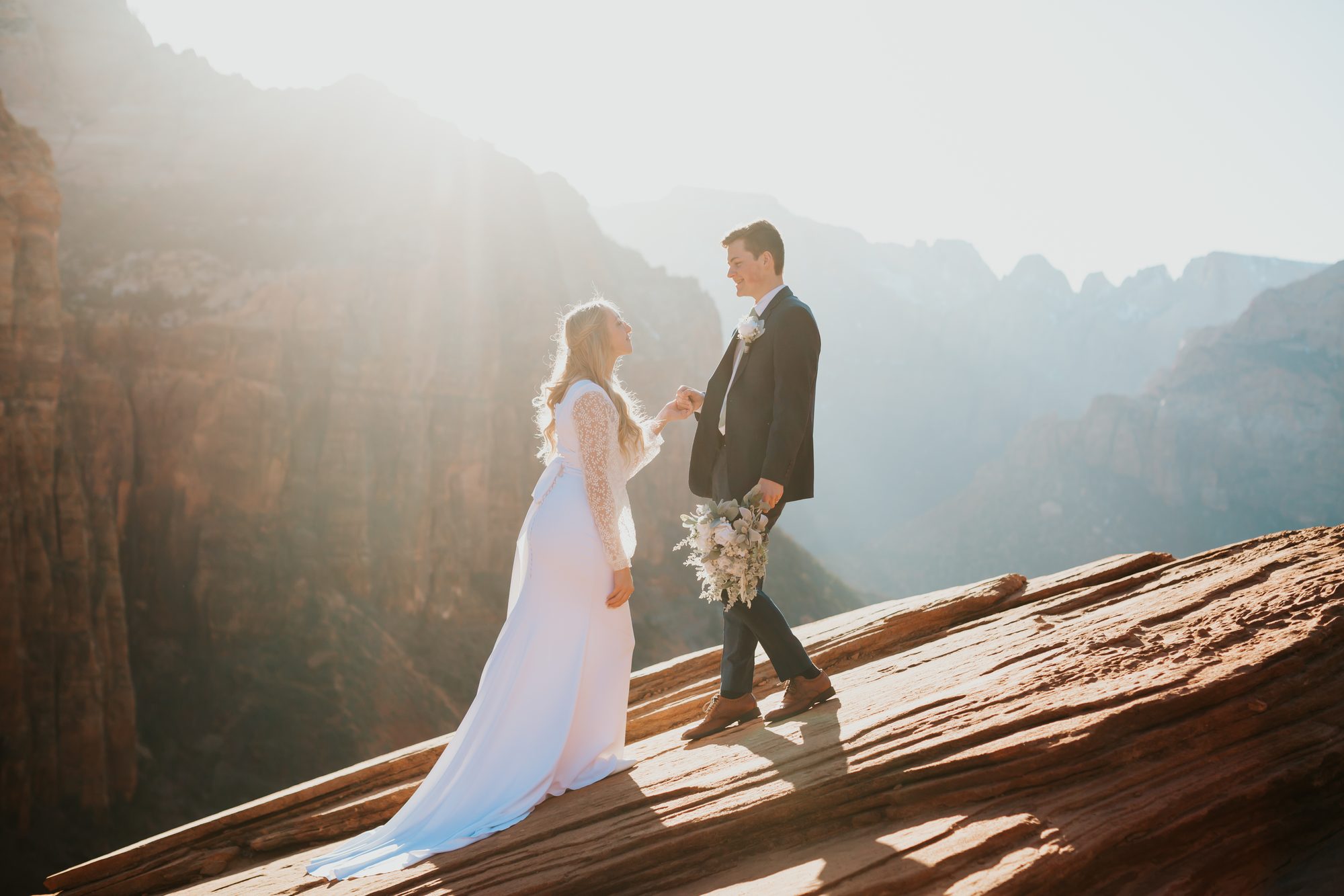 Annabelle and Jason kiss Zion elopement red rock