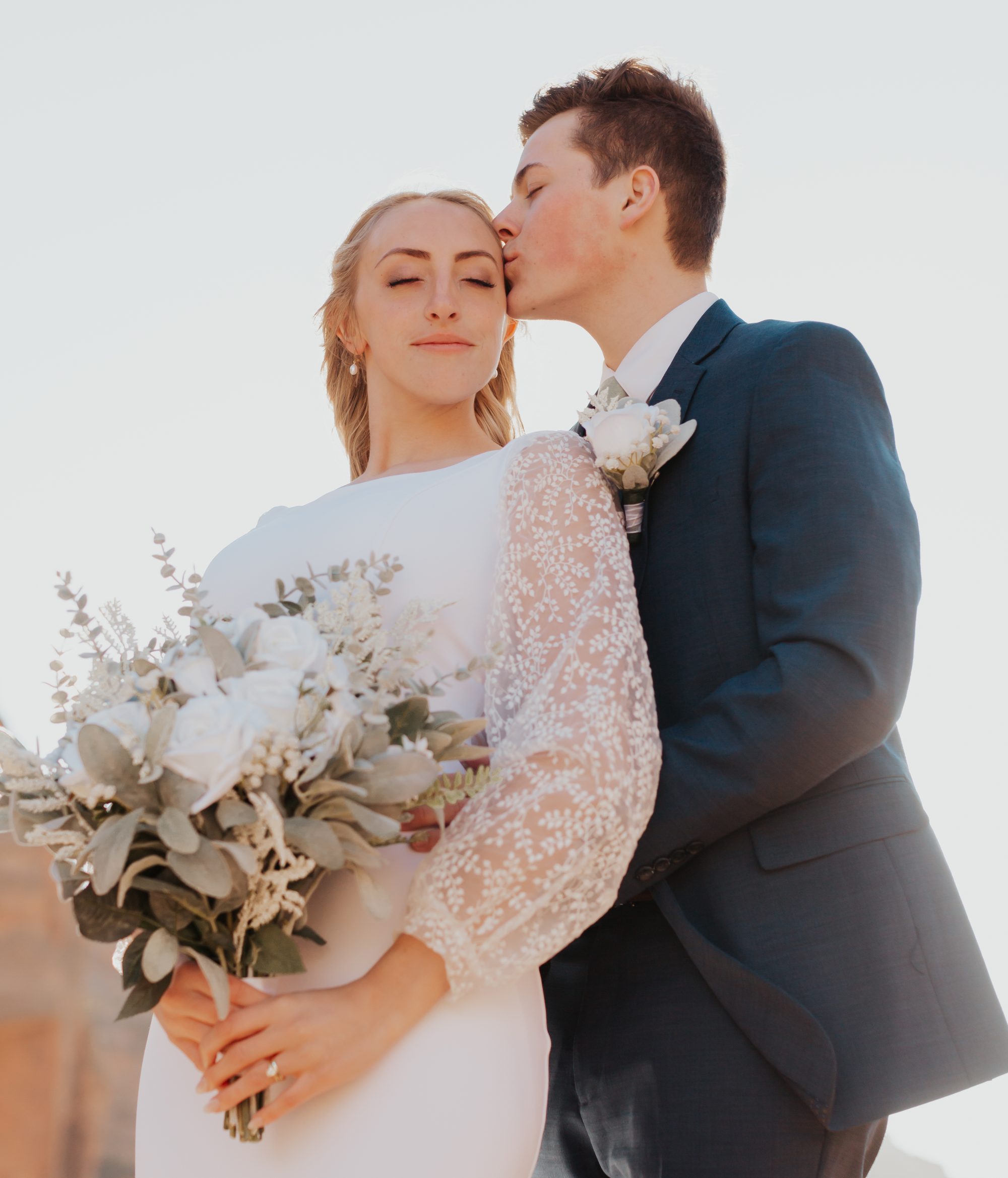 Annabelle and Jason walking Zion elopement red rock