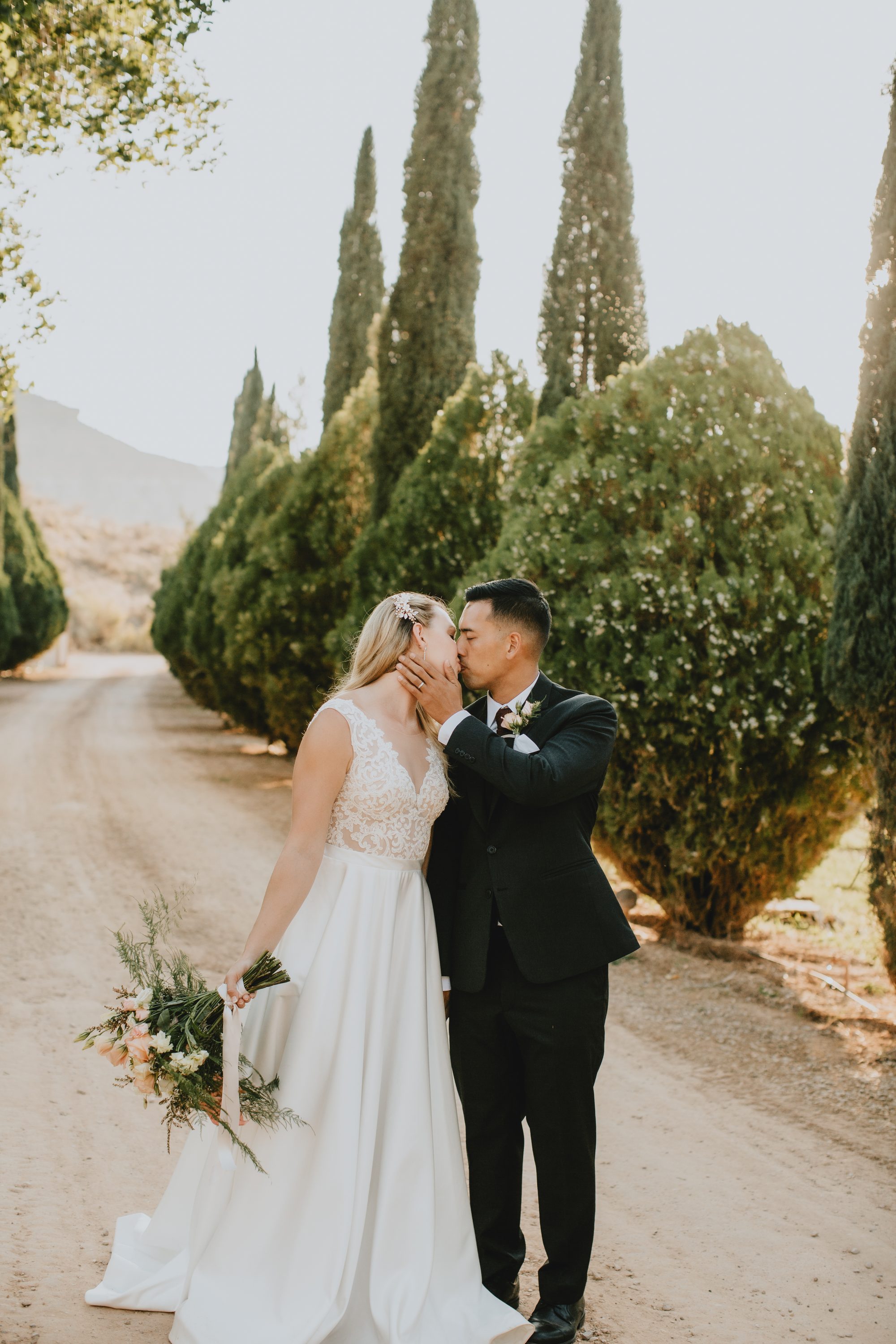 Kate and Manny embrace Southern Utah wedding